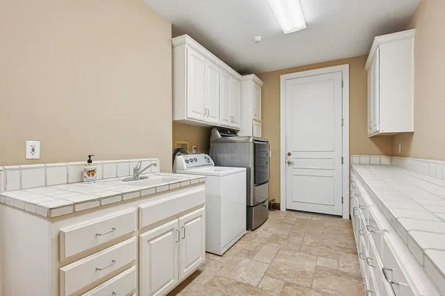 a bathroom with a bathtub and next to a window