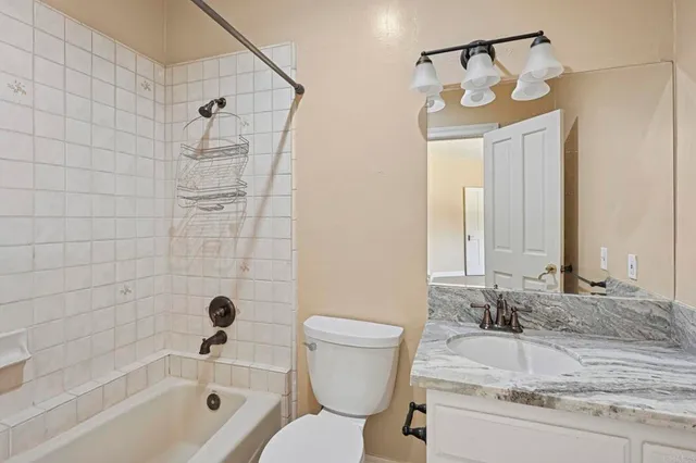 a spacious bathroom with a double vanity sink and mirror