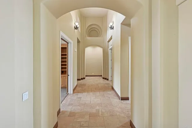 a bathroom with a tub a sink and a large mirror