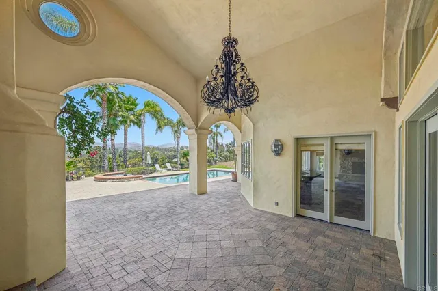 an empty room with wooden floor and a window
