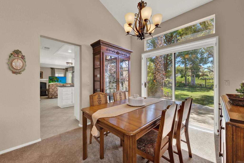 3761 Hillview Way Oceanside, CA 92056 - Photo 12 of 75 a view of a dining room with furniture wooden floor and chandelier