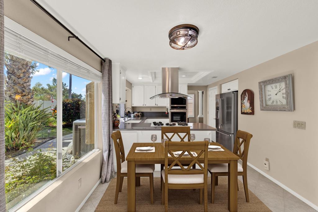 3761 Hillview Way Oceanside, CA 92056 - Photo 16 of 75 a view of a dining room with furniture window and outside view
