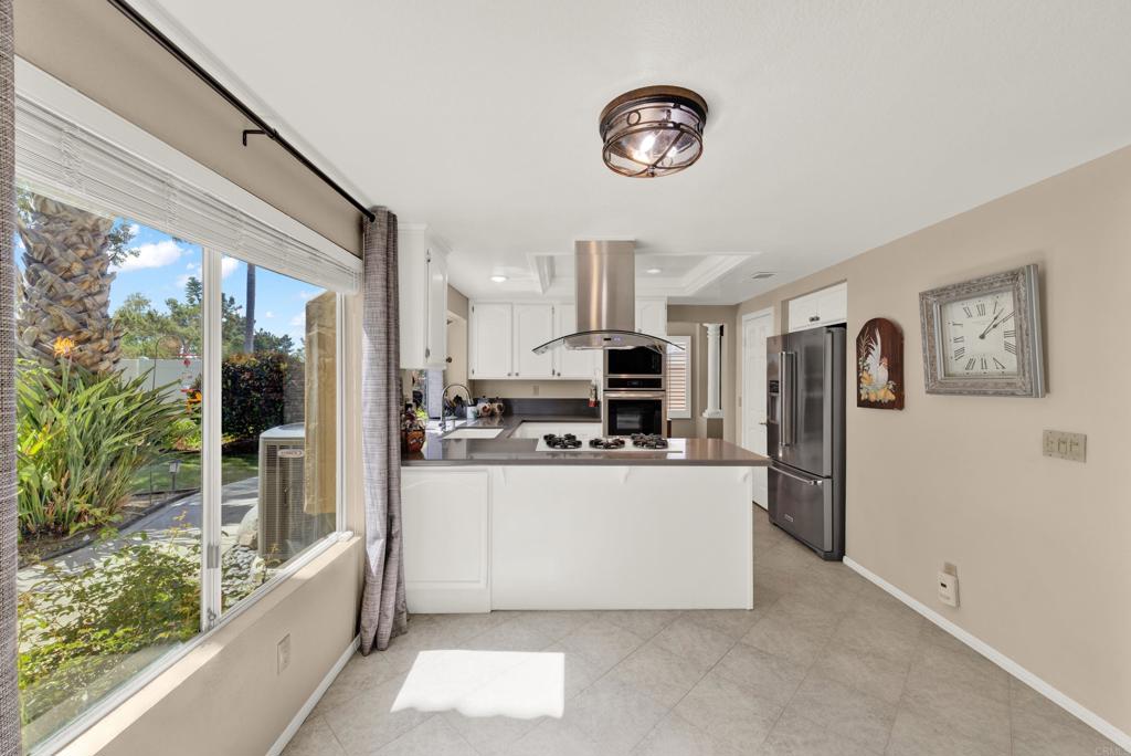 3761 Hillview Way Oceanside, CA 92056 - Photo 17 of 75 a kitchen with stainless steel appliances a refrigerator a stove top oven a sink and dishwasher