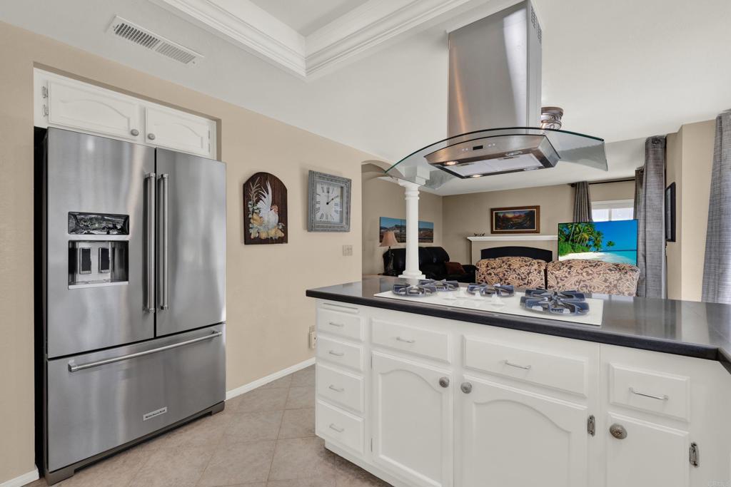 3761 Hillview Way Oceanside, CA 92056 - Photo 22 of 75 a kitchen with stainless steel appliances granite countertop a sink and a refrigerator
