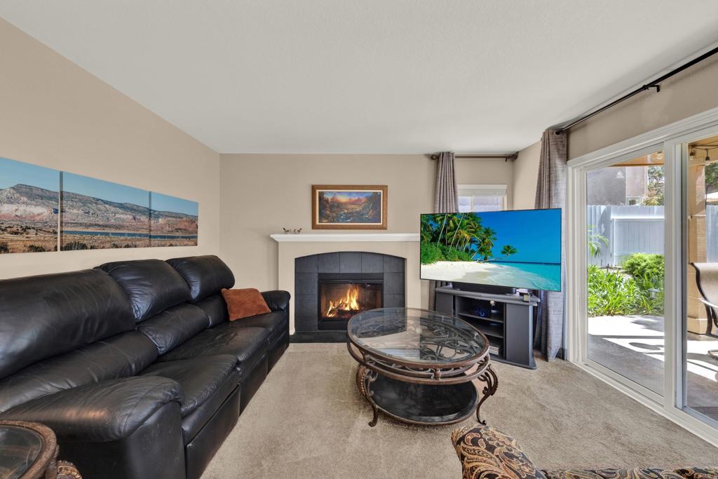 3761 Hillview Way Oceanside, CA 92056 - Photo 25 of 75 a living room with furniture and a fireplace