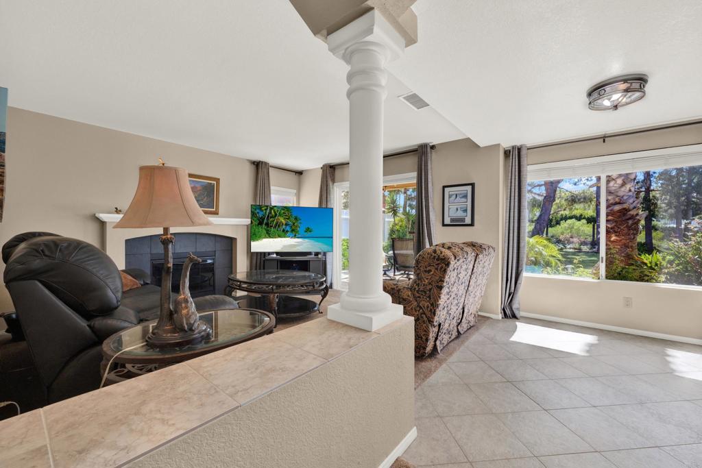 3761 Hillview Way Oceanside, CA 92056 - Photo 29 of 75 a living room with fireplace furniture and a large window