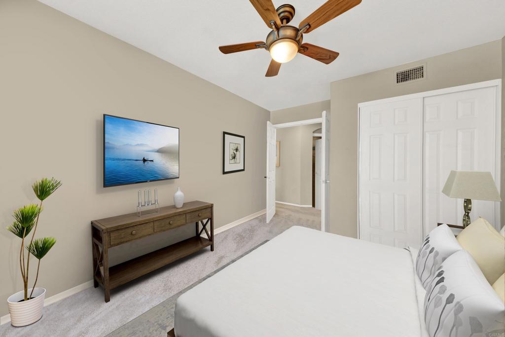 3761 Hillview Way Oceanside, CA 92056 - Photo 37 of 75 a bedroom with a bed and a chandelier