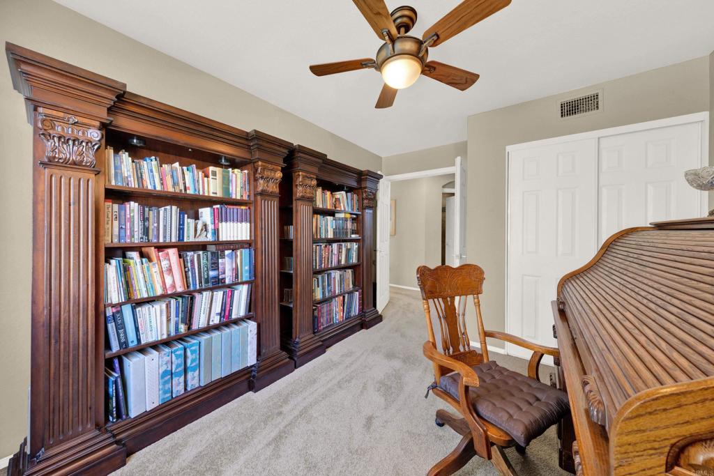 3761 Hillview Way Oceanside, CA 92056 - Photo 38 of 75 a view of a workspace with furniture and a book shelf