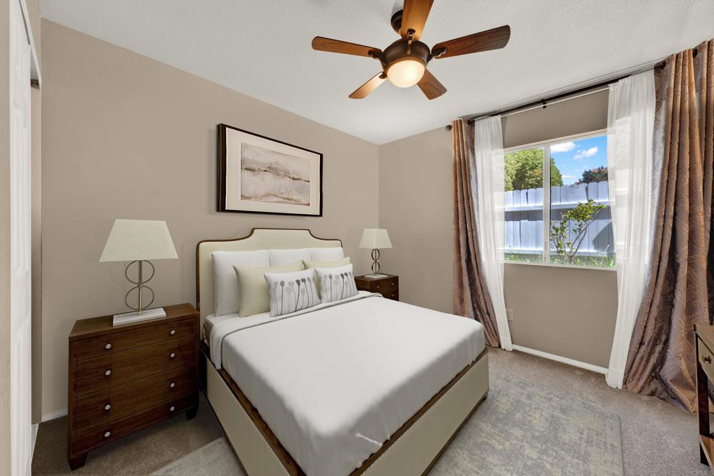 3761 Hillview Way Oceanside, CA 92056 - Photo 39 of 75 a bedroom with a large bed and a window