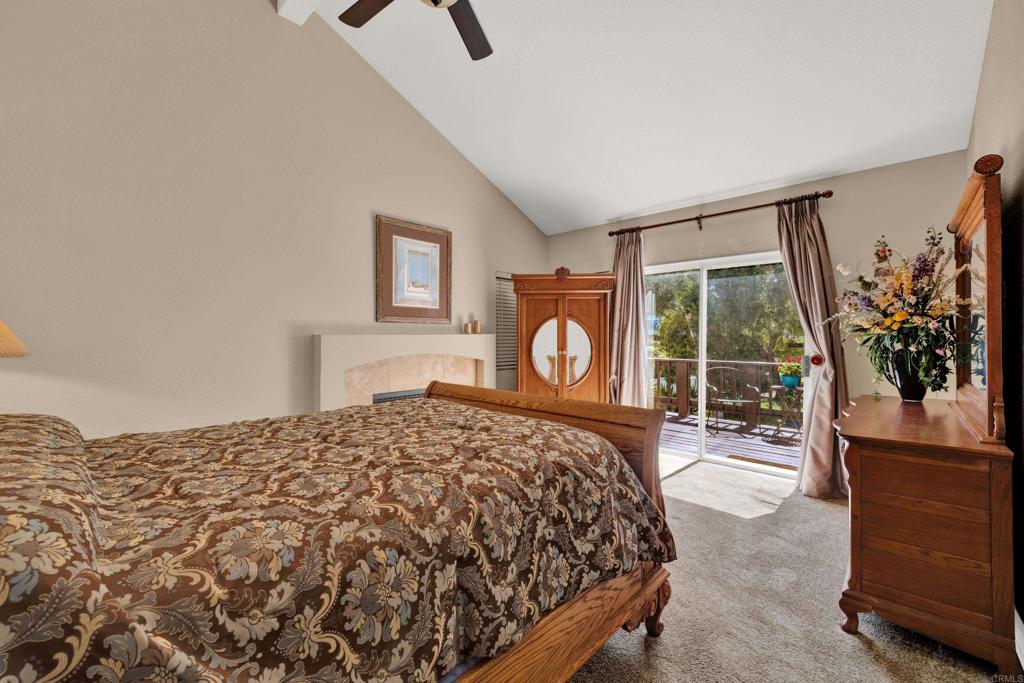 3761 Hillview Way Oceanside, CA 92056 - Photo 47 of 75 a bedroom with a bed a mirror and a window