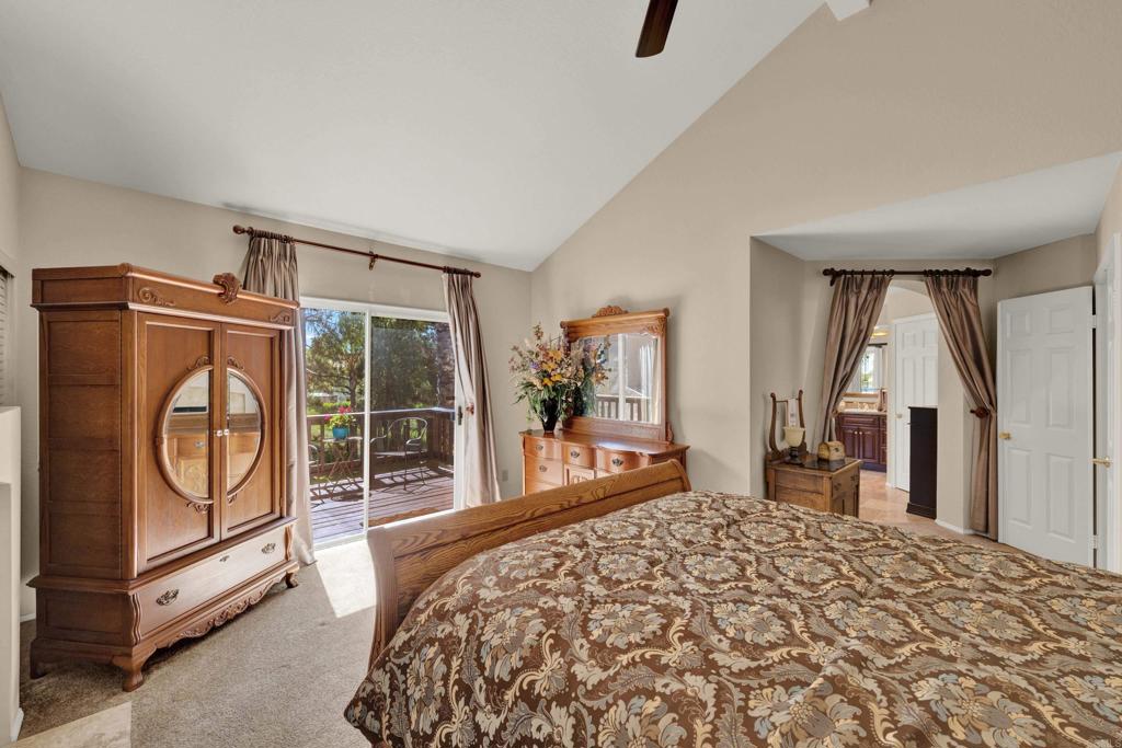 3761 Hillview Way Oceanside, CA 92056 - Photo 54 of 75 a bedroom with a bed and a dresser next to a window