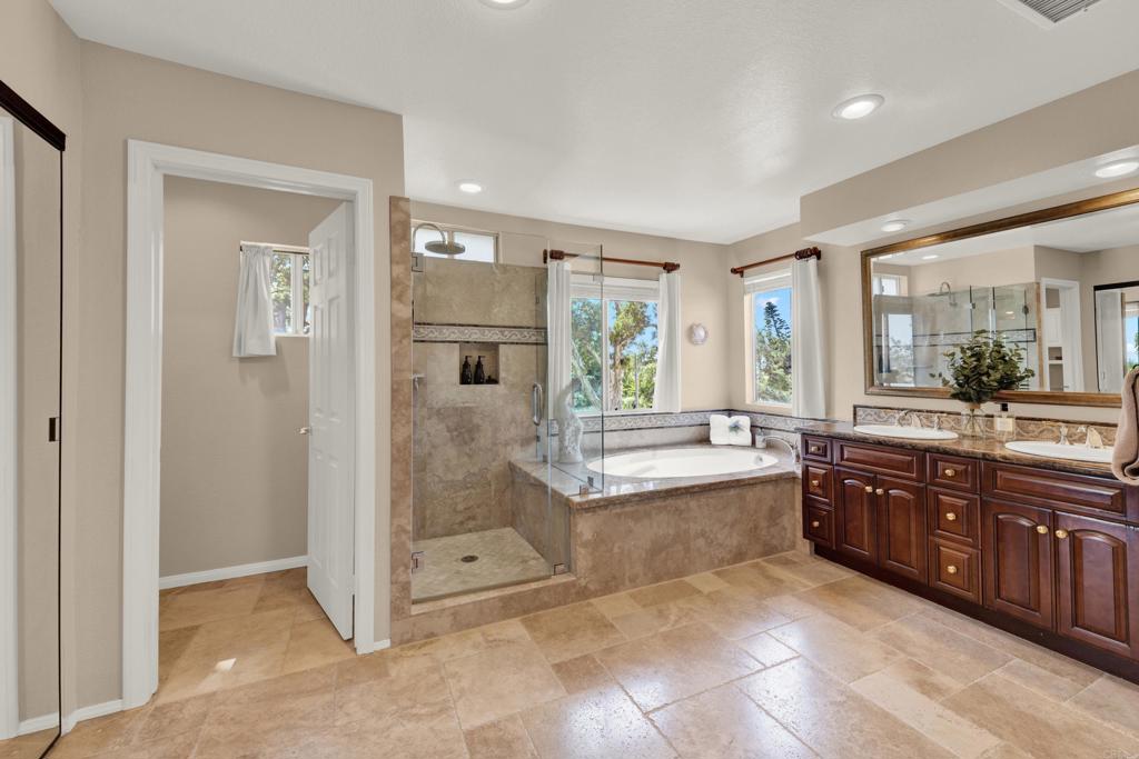 3761 Hillview Way Oceanside, CA 92056 - Photo 55 of 75 a spacious bathroom with a tub sink shower and mirror