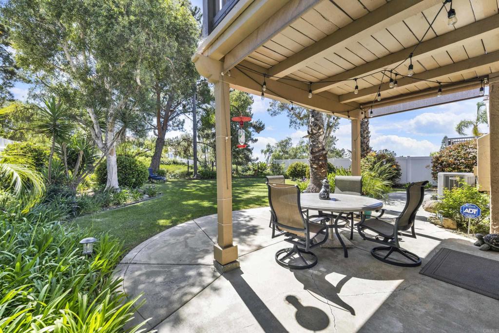 3761 Hillview Way Oceanside, CA 92056 - Photo 67 of 75 a view of a patio with a table chairs and a backyard