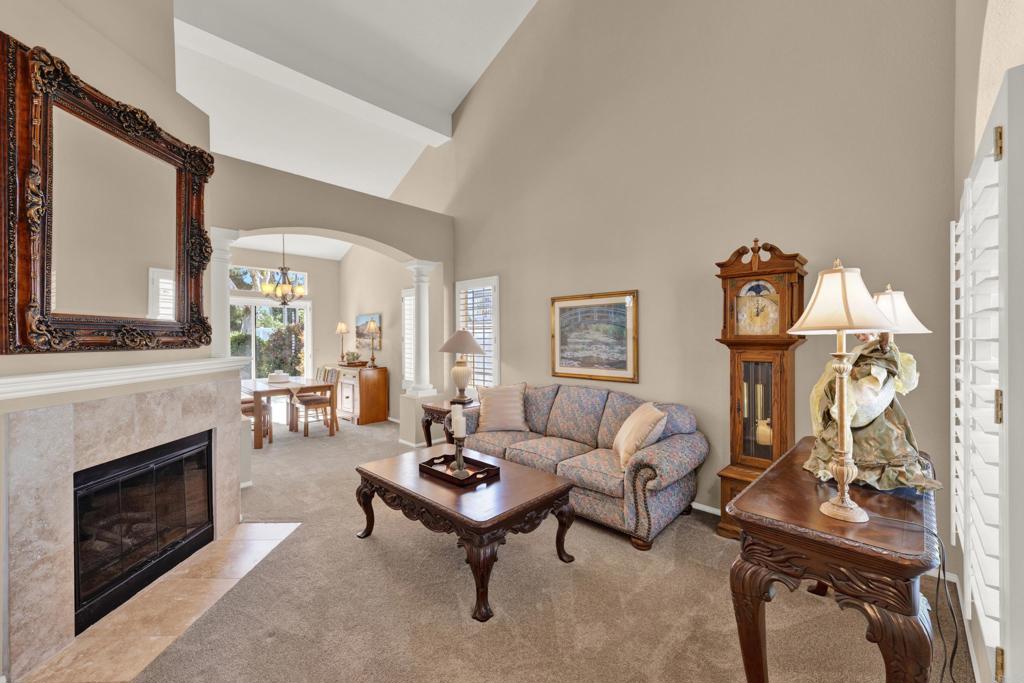 3761 Hillview Way Oceanside, CA 92056 - Photo 7 of 75 a living room with furniture a fireplace and a flat screen tv