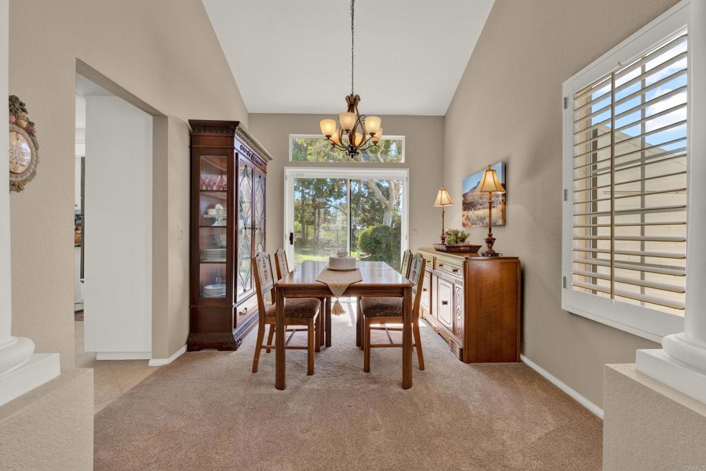 3761 Hillview Way Oceanside, CA 92056 - Photo 9 of 75 a dining room with furniture a livingroom and chandelier