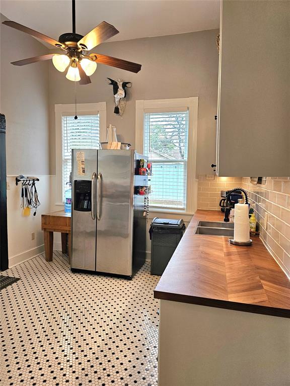 1111 West Main Street Denison, TX 75020 - Photo 11 of 36 Large kitchen with lighted cabinets, and modern appliances