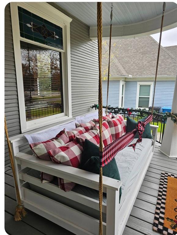 1111 West Main Street Denison, TX 75020 - Photo 22 of 36 Fabulous front porch swing