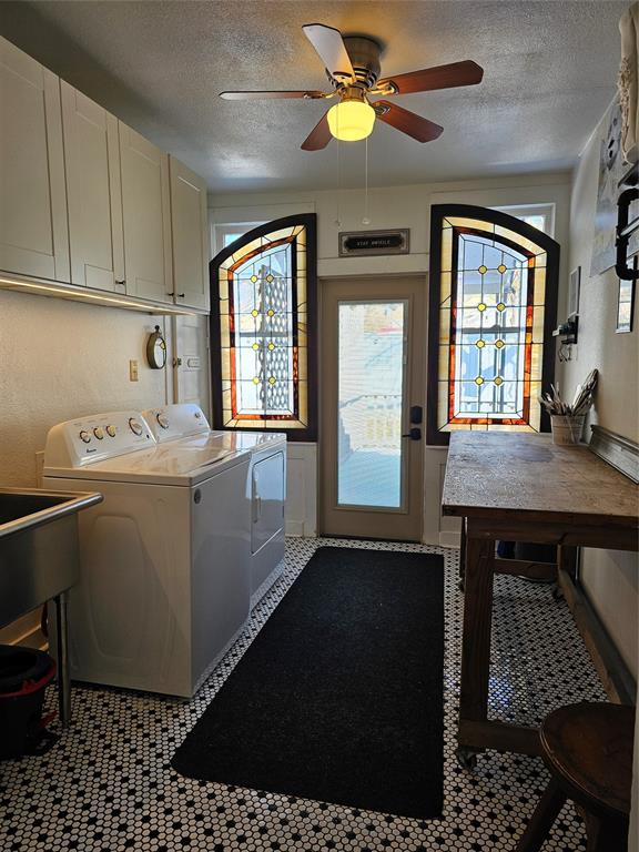 1111 West Main Street Denison, TX 75020 - Photo 29 of 36 Great utility room with stainless utility sink and tons of storage