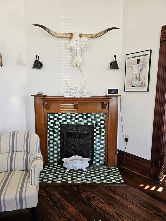 1111 West Main Street Denison, TX 75020 - Photo 8 of 36 a living room with furniture a fireplace and a table