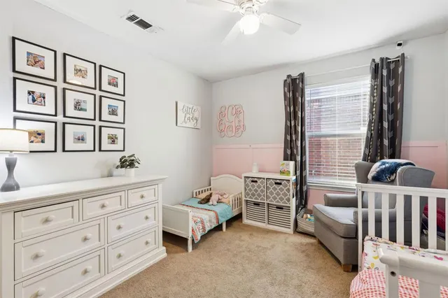 a bedroom with furniture and a window