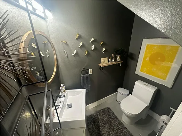 a large bedroom with a bed and furniture