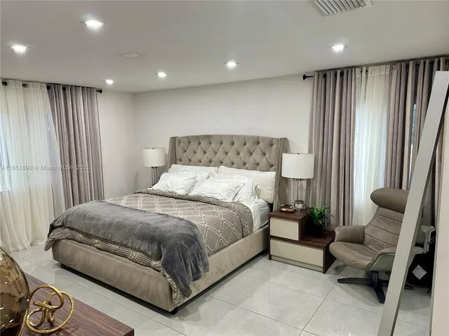 a bathroom with a double vanity sink and mirror