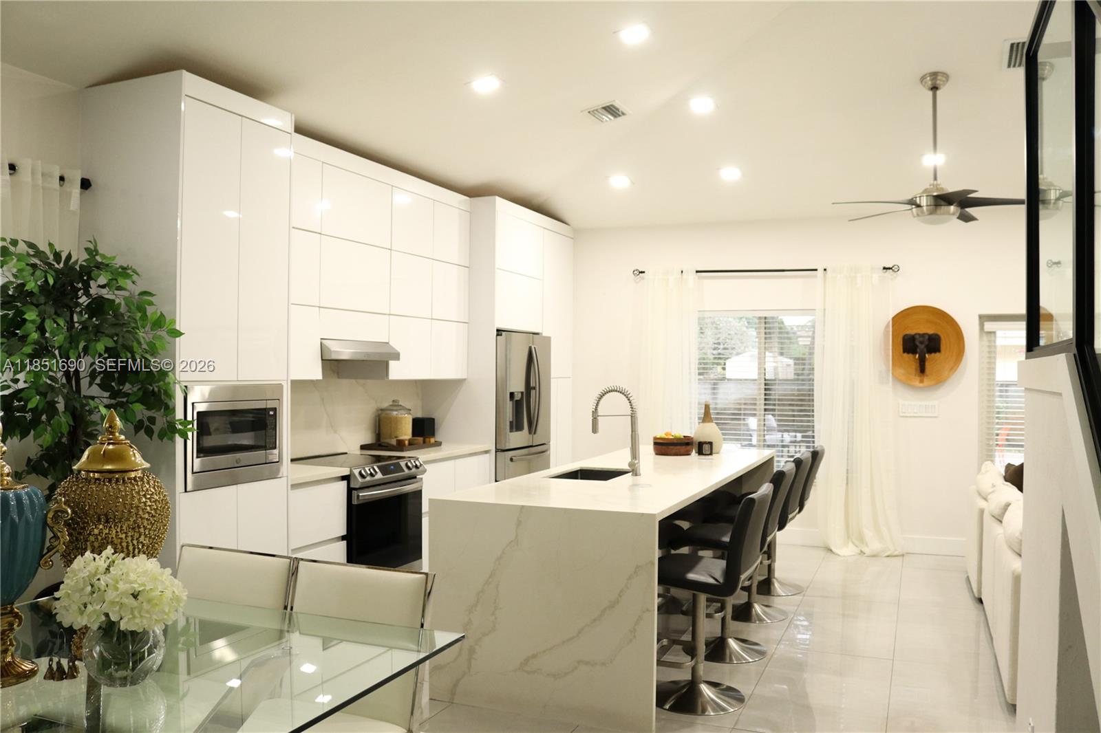 11 Northeast 151st Street Miami, FL 33162 - Photo 17 of 95 a large kitchen with a large counter top appliances and cabinets