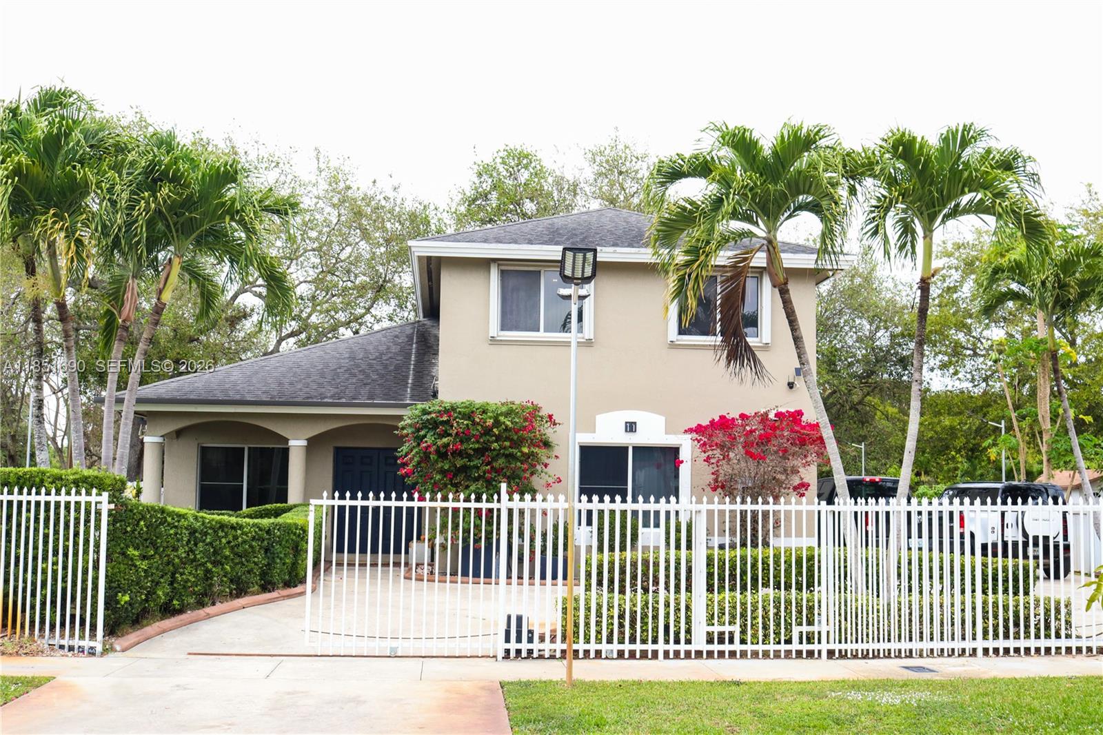 11 Northeast 151st Street Miami, FL 33162 - Photo 2 of 95 a view of a house with a porch