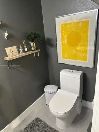 a en suite bathroom with a double vanity sink a mirror and shower