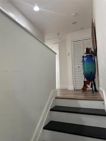 a bed sitting in a bedroom and chair