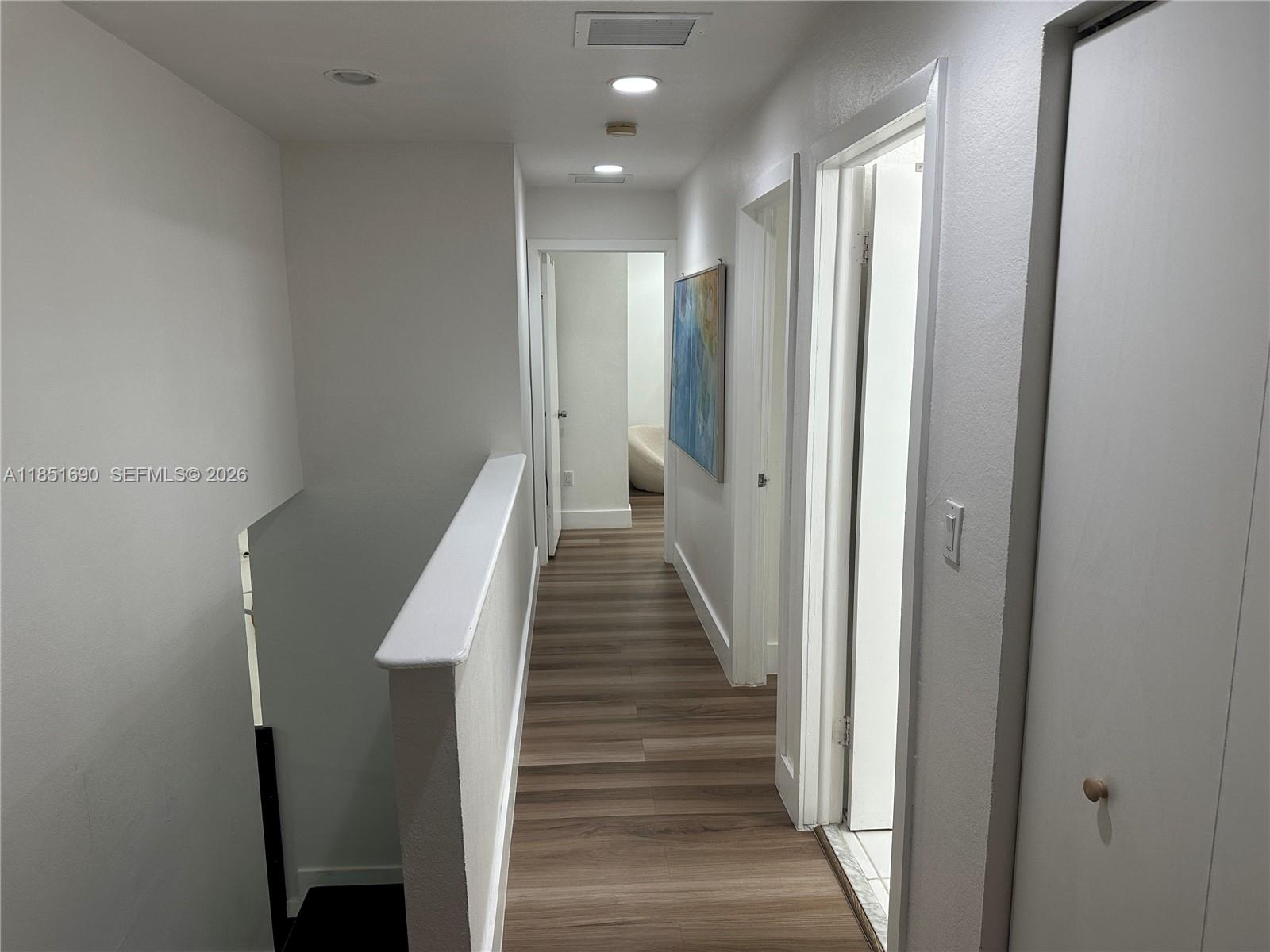11 Northeast 151st Street Miami, FL 33162 - Photo 49 of 95 a view of a hallway with wooden floor and entryway