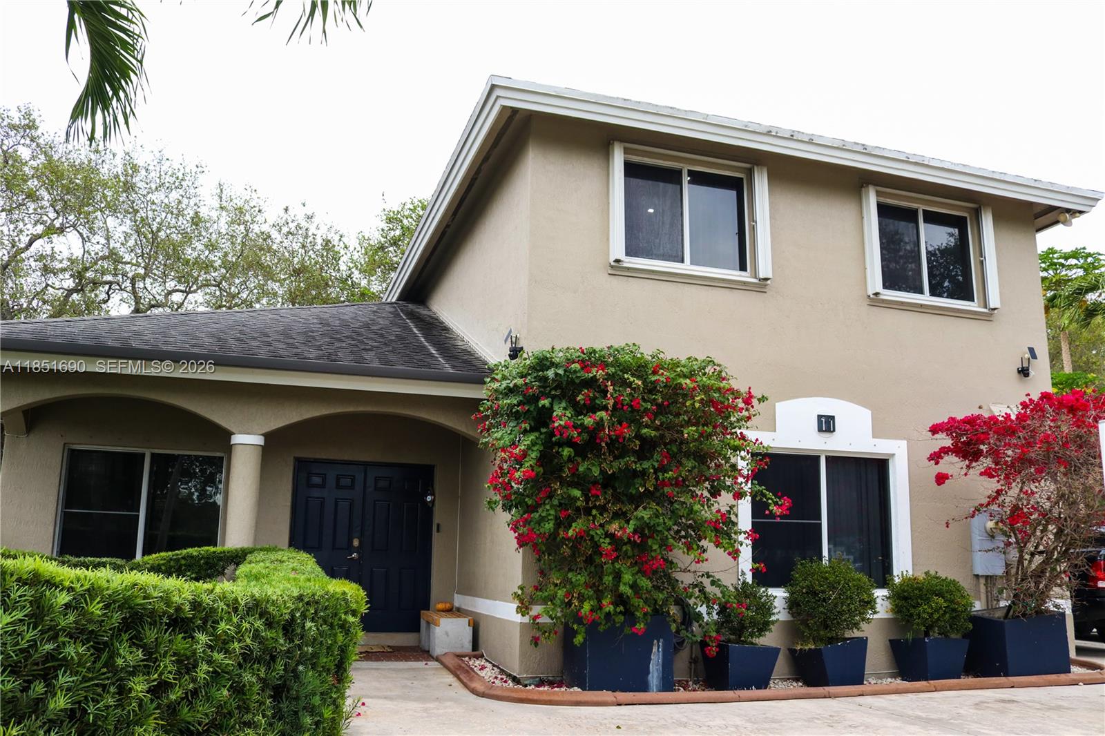 11 Northeast 151st Street Miami, FL 33162 - Photo 5 of 95 a front view of a house with plants