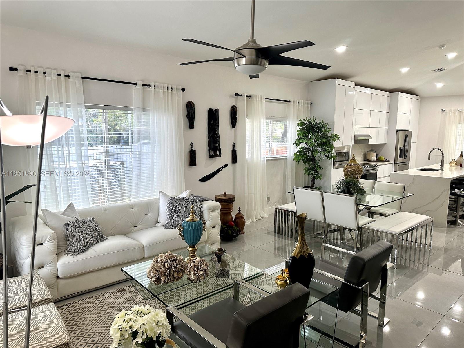 11 Northeast 151st Street Miami, FL 33162 - Photo 7 of 95 a living room with furniture and a large window