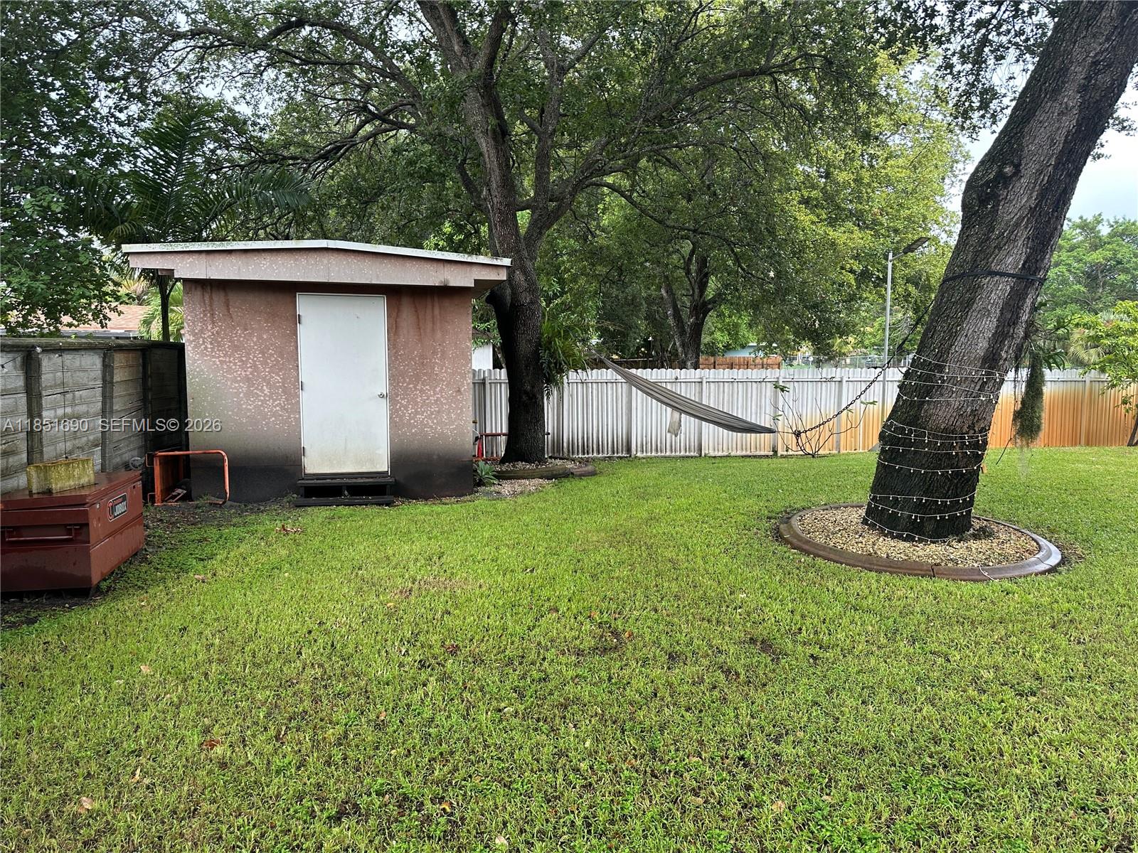 11 Northeast 151st Street Miami, FL 33162 - Photo 88 of 95 a view of a backyard with a tub