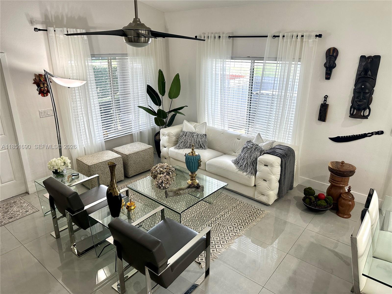 11 Northeast 151st Street Miami, FL 33162 - Photo 9 of 95 a living room with furniture and a window