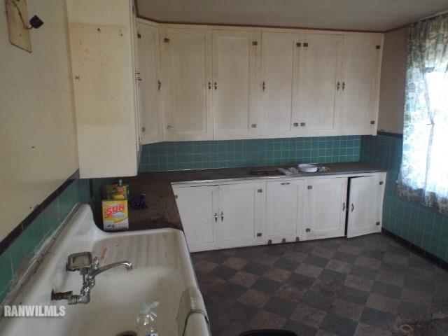 10905 South Massbach Road Elizabeth, IL 61028 - Photo 3 of 41 a view of a kitchen with white cabinets
