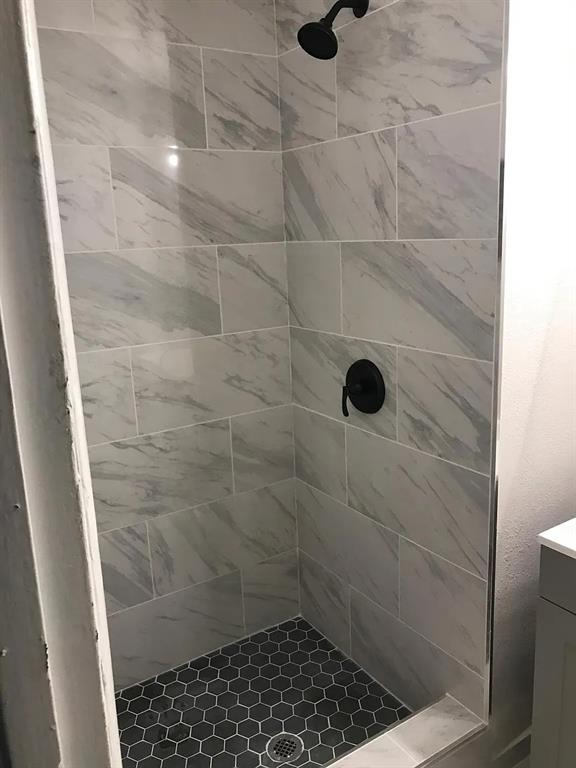 1617 East Union Bower Road Irving, TX 75061 - Photo 8 of 14 a bathroom with a shower