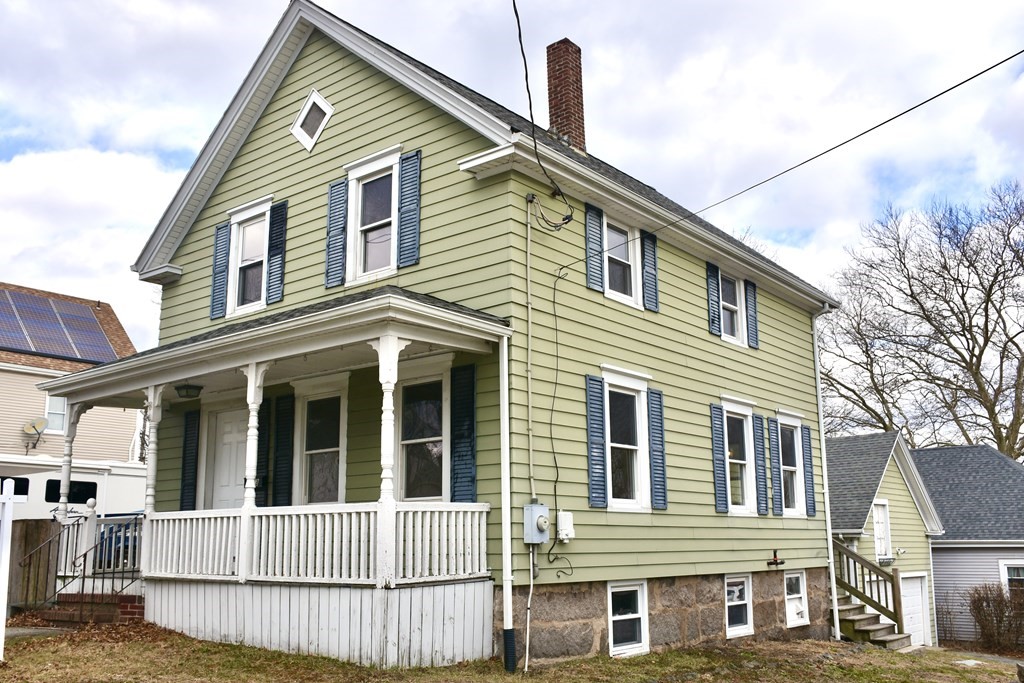 a view of a brick house with many windows