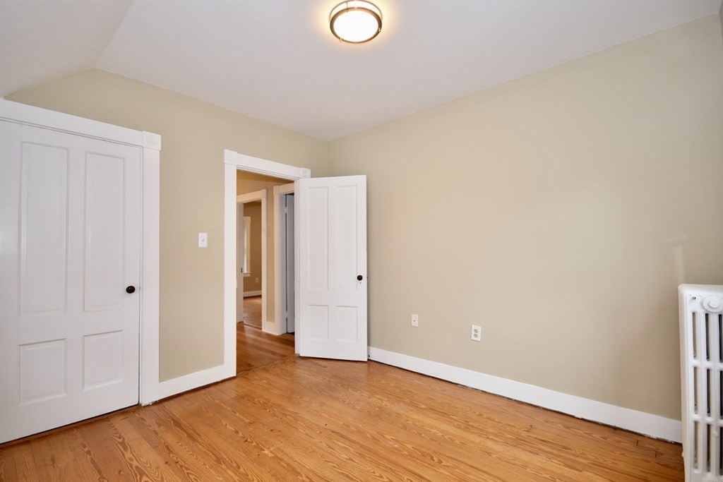 253 Adams Street Fairhaven, MA 02719 - Photo 12 of 17 a view of an empty room and wooden floor