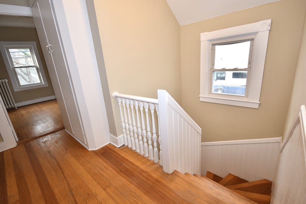 253 Adams Street Fairhaven, MA 02719 - Photo 15 of 17 a view of an empty room with wooden floor and a window