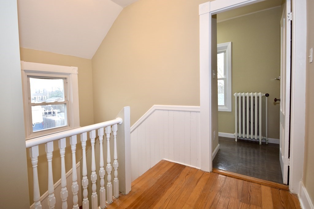 253 Adams Street Fairhaven, MA 02719 - Photo 16 of 17 a view of a hallway with wooden floor and a window
