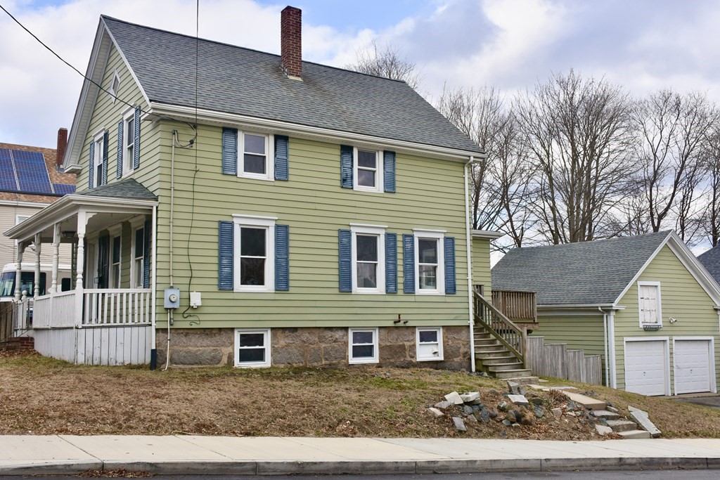 253 Adams Street Fairhaven, MA 02719 - Photo 2 of 17 a front view of a house with a garden