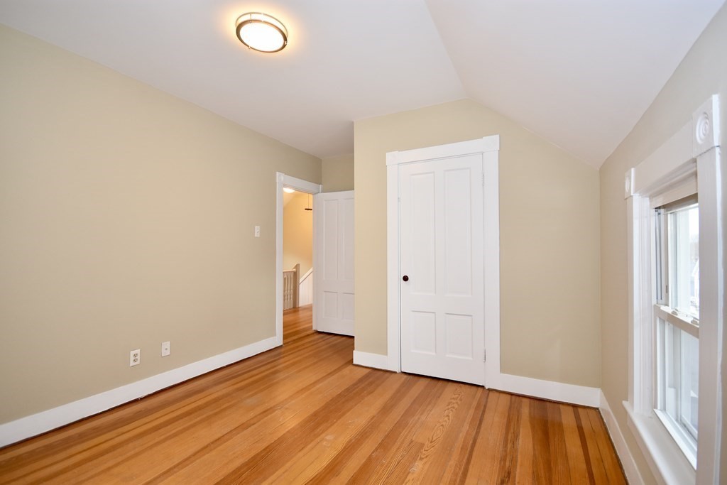253 Adams Street Fairhaven, MA 02719 - Photo 10 of 17 a view of room with window and wooden floor