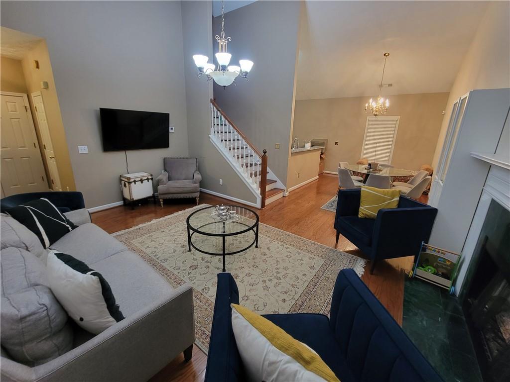 1002 Cedar Trace Southwest Lilburn, GA 30047 - Photo 4 of 11 a living room with furniture and a flat screen tv