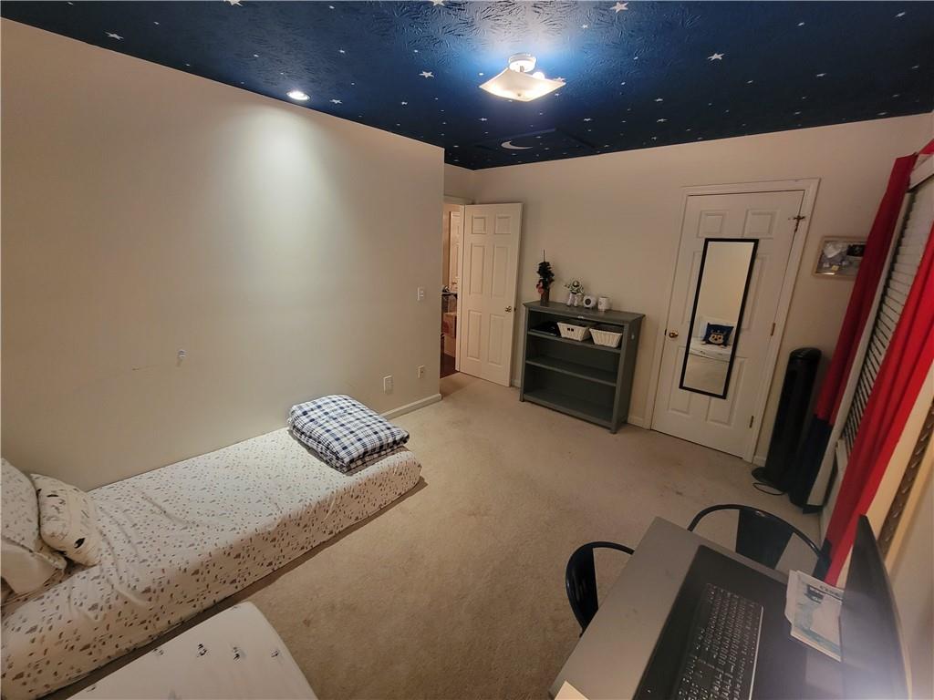 1002 Cedar Trace Southwest Lilburn, GA 30047 - Photo 8 of 11 a hallway with granite countertop