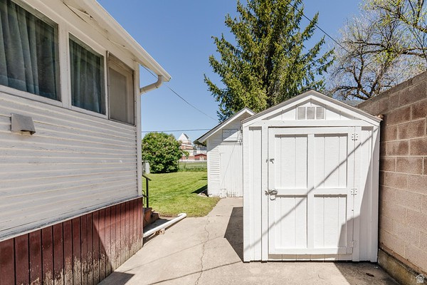 365 West 200 North Logan, UT 84321 - Photo 41 of 45 White storage shed featuring double doors and a gable roof with vents