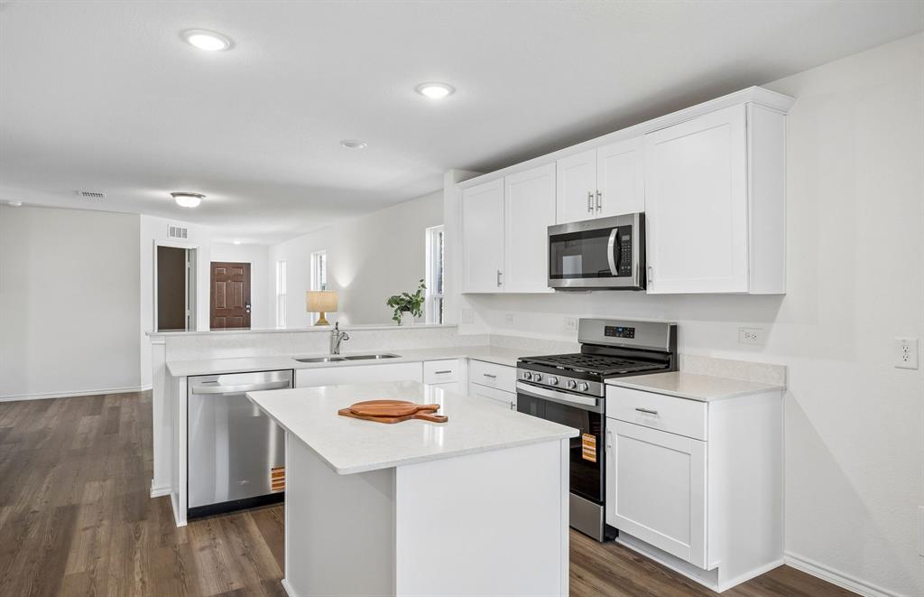 14134 Olney Drive Pilot Point, TX 76258 - Photo 8 of 24 *Model representation Abundant cabinet space provided in kitchen