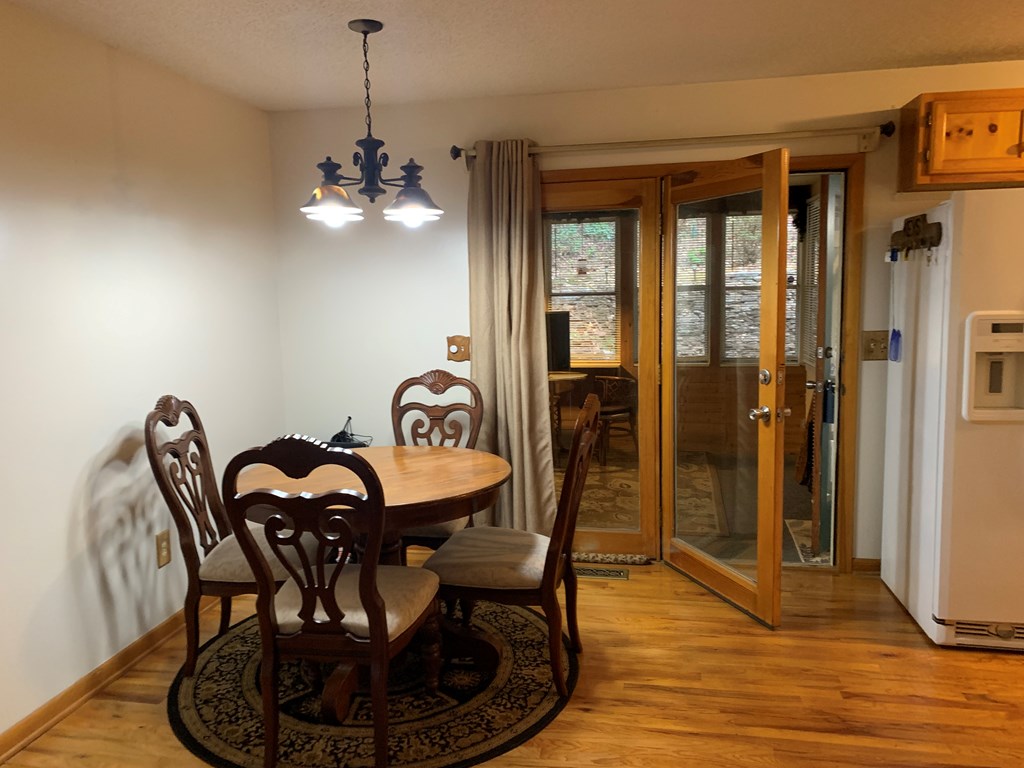 55 Laurel Spring Drive Murphy, NC 28906 - Photo 12 of 73 a view of a dining room with furniture window and wooden floor