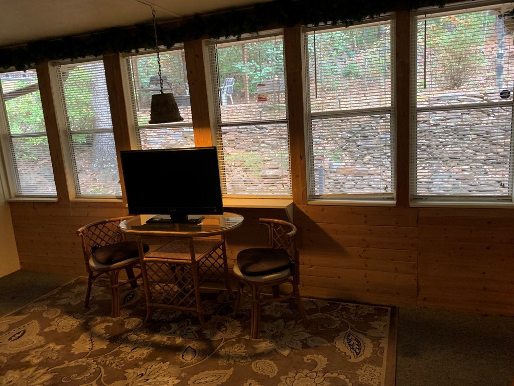 55 Laurel Spring Drive Murphy, NC 28906 - Photo 15 of 73 a living room with a window and a table