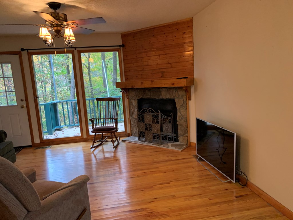 55 Laurel Spring Drive Murphy, NC 28906 - Photo 19 of 73 a living room with furniture and a fireplace